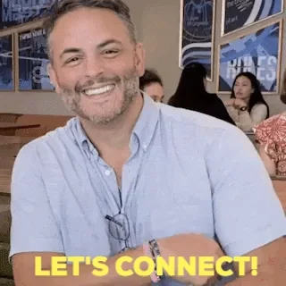 A man smiles and holds up a LinkedIn mug. The text reads: 