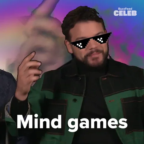 A person pointing at his head saying, 