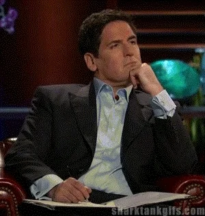 A Dragons Den host taking notes in a notebook.
