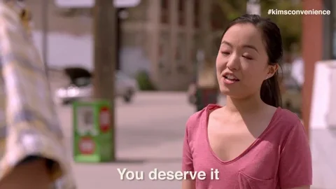 A woman saying, 'You deserve it.'