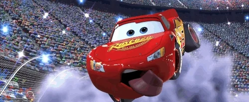 Lightning McQueen floating through a stadium with fireworks in the background.