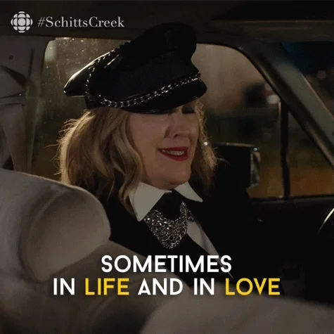 Moira Rose from Schitt's Creek in car. She turns around and says, 'Sometimes in life and in love risks must be taken.'