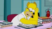 Homer Simpson reading a book.