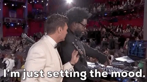 Questlove is at a DJ booth at an award show. He tells host Ryan Seacrest, 