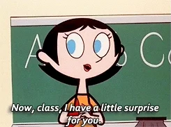 Teacher from The Powerpuff Girls cartoon says 'Now, class, I have a little surprise for you'
