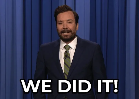 Jimmy Fallon shrugs and smiles while overlaid text reads 'We did it!'