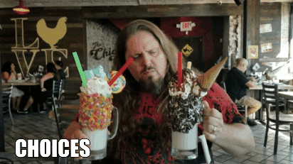 Man trying to choose between two ice cream sundaes