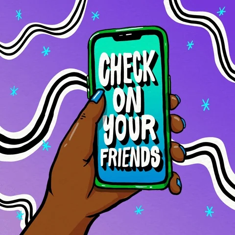 A person holding a phone. On the screen, the text reads: 
