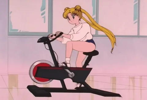Sailor Moon working out on a stationary bike.
