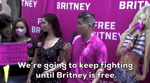 A pro-Britney activist at a rally, saying 'We're going to keep fighting until Britney is free.'