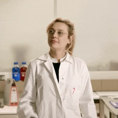 A woman in lab coat suddenly had a bright idea.