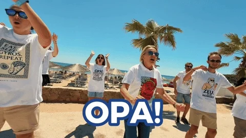 People dancing on a beach and shouting, 