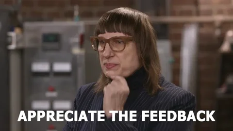 A woman with glasses and bangs, says: 