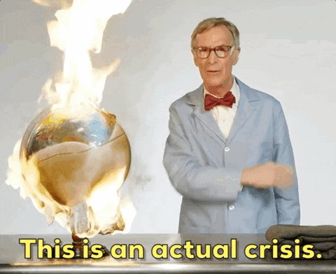 Billy Nye The Science Guy pointing to a globe on fire. He says, 