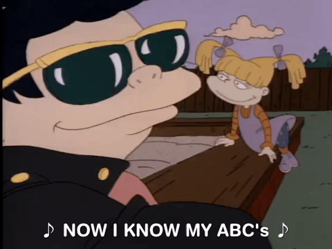 A Rugrats character singing, 'Now I know my ABC's.'