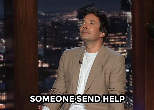 Jimmy Fallon in a beige blazer, saying 