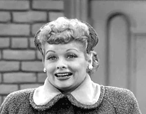 Lucille Ball taking a deep breath while looking relaxed.