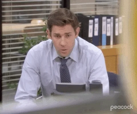 Jim from The Office is visibly stressed and sighing. 