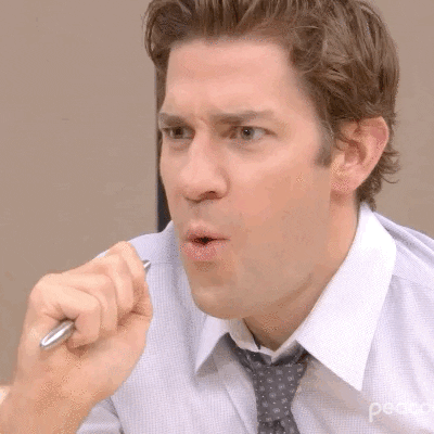 Jim Halpert from The Office looking shocked and delighted. 