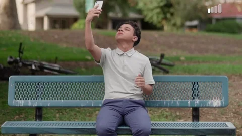 A young man looking for phone service.