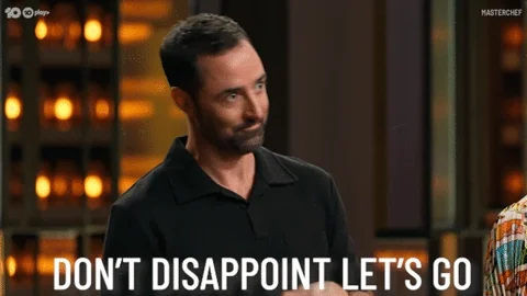 A man rubs his hands and says, 