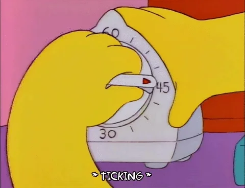 Someone from the Simpsons cartoon setting a timer.