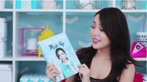 Michelle Phan showing her make up guide