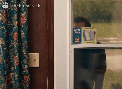 David from the Schitt's Creek walking through a door while saying, "Question."