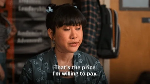 A woman speaks, with the caption “That's the price I'm willing to pay” written at the bottom.