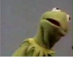 Looking toward us, Kermit looks surprised and then embarrassed as he turns slowly away.