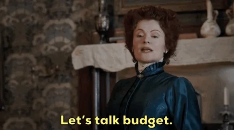 A woman saying, 'Let's talk budget'. 