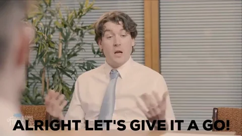 A man in an office saying, 
