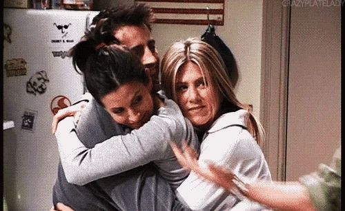The cast of 'Friends' have a group hug.