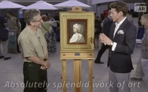 A person talking about a painting, saying 
