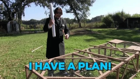 A man says, "I have a plan!" while opening a blueprint. 