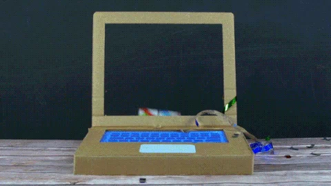 GIF of hand coming out of a cardboard computer handing someone a gift. 