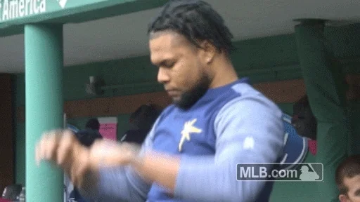 A man warming up before engaging in a sport.