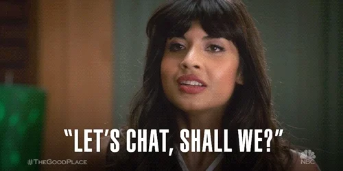A woman saying 'Let's chat, shall we?'