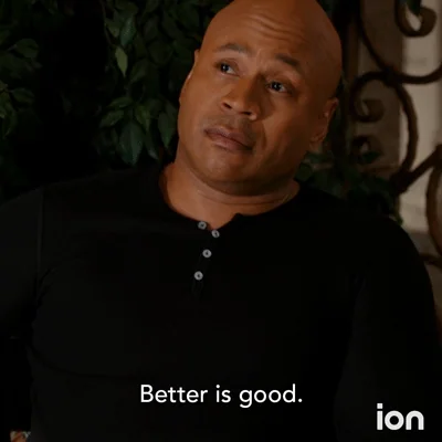 A person in a black shirt sits indoors with their eyes partly closed, with the caption “Better is good.” 