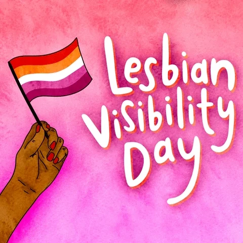 A hand waving a lesbian flag. The text reads, 'Lesbian Visibility Day'.