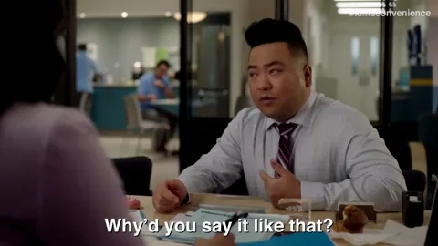 An office worker turns to a coworker and asks, 