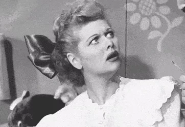 Lucille Ball from I Love Lucy makes a confused face.