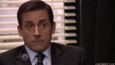 Steve Carell as Michael Scott in The Office looking nervous and saying, 