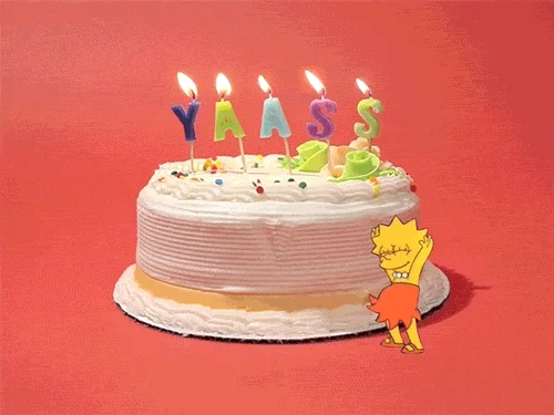 Dancing Lisa Simpson next to cake with candles spelling 'yaass'