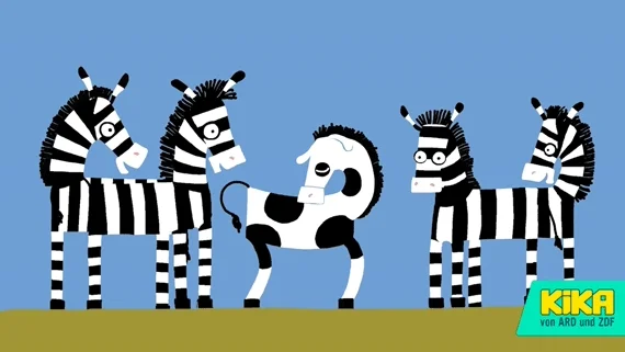4 regular zebras and one 'different' one: jumping happily in the middle.