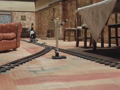 Animated animals riding on a train track.