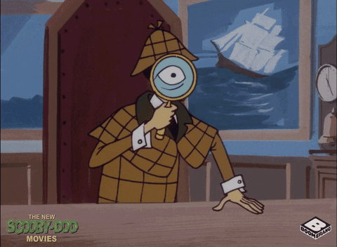 a detective is holding a magnifying glass to their eye looking for clues