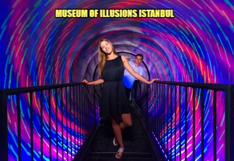 people walking on a metal bridge indoors as lights swirl around. text reads Museum of Illusions Istanbul.