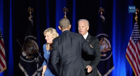 Obama and Biden hugging on stage