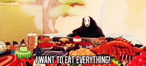 No Face from Spirited Away sitting at a feast with text that reads, 'I want to eat everything!'